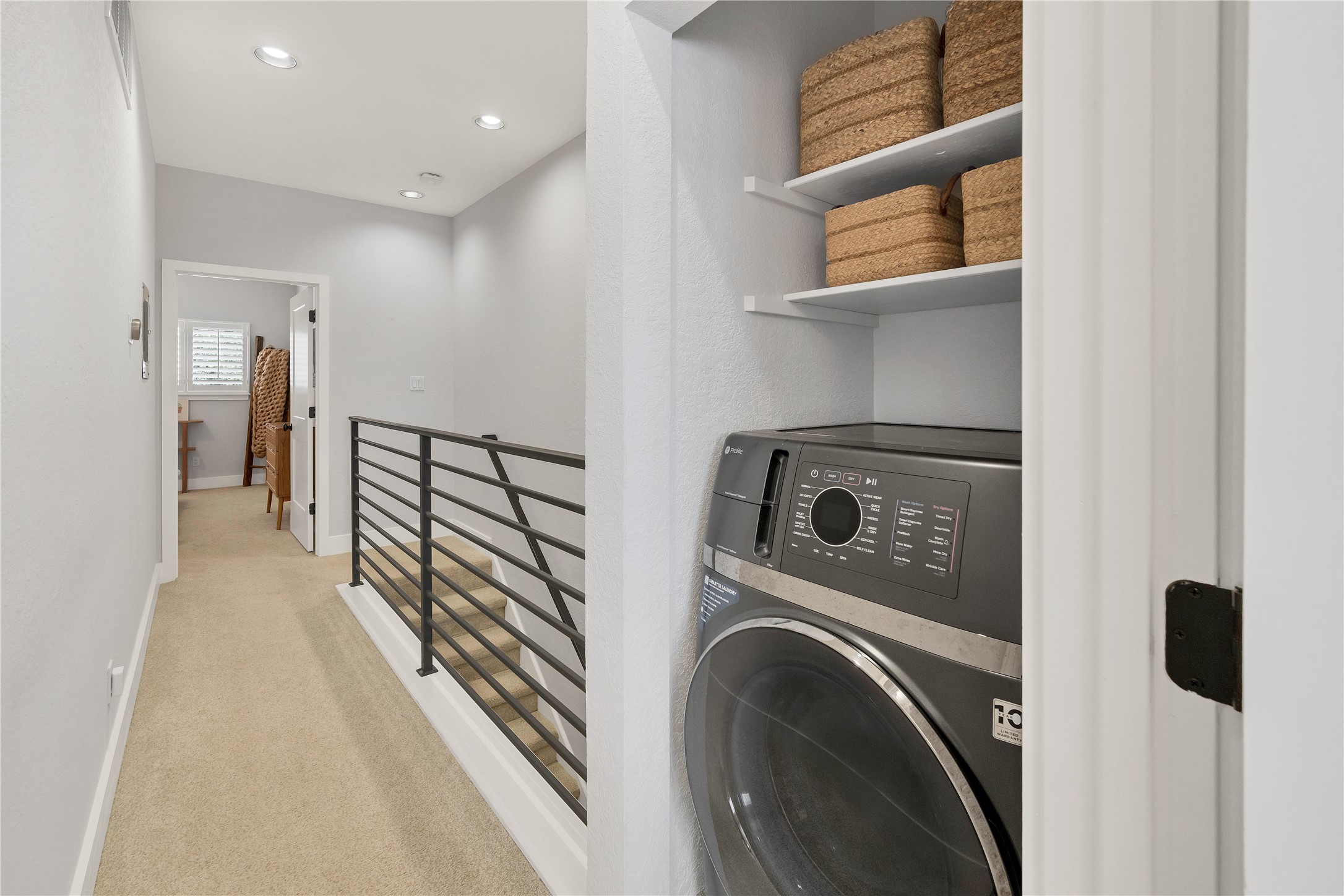 2605 Enfield Road, Unit 221 Austin, TX 78703 - Photo 17 of 30 Combination washing machine/dryer (stays with condo) was relocated to upstairs hall closet for convenience between bedrooms.