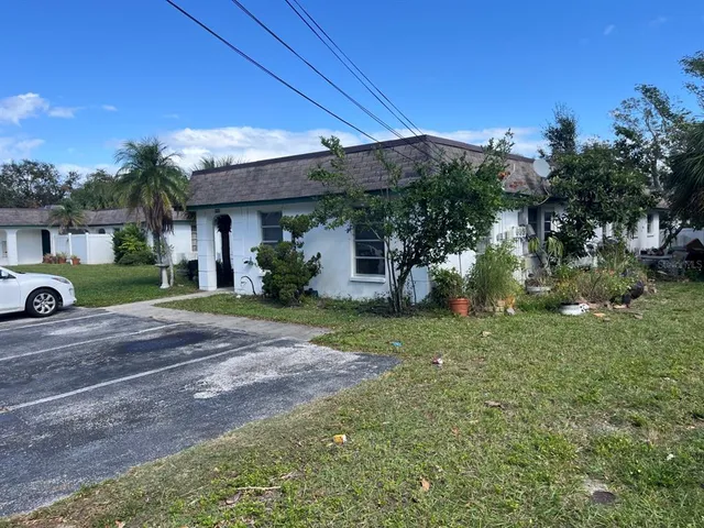 a view of a house with a street