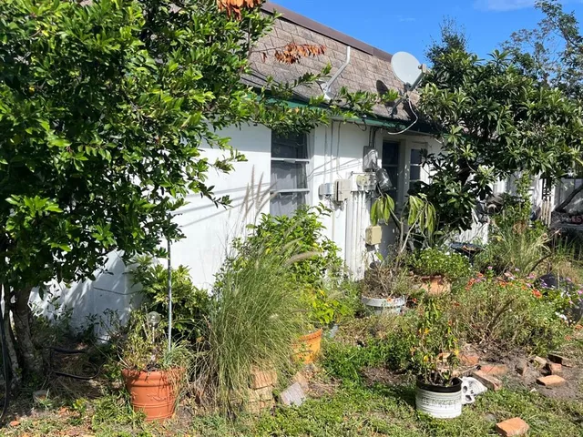 a backyard of a house with lots of green space