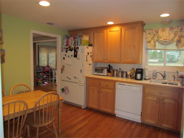 145 Richdale Road Needham, MA 02494 - Photo 2 of 11 a kitchen with a sink cabinets and window