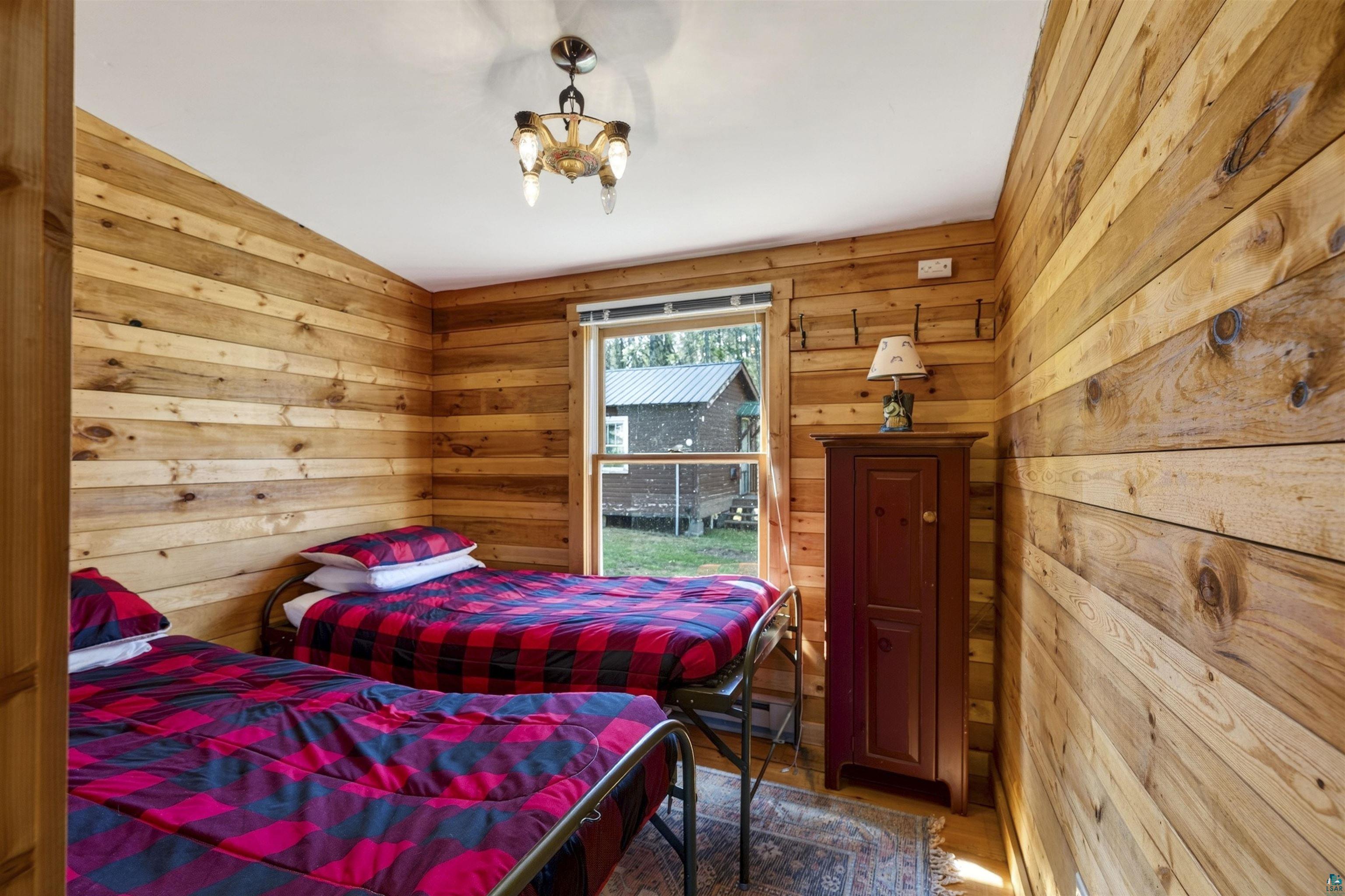 13885 Park Road Brule, WI 54820 - Photo 30 of 41 Interior room featuring light-toned wood paneling on walls