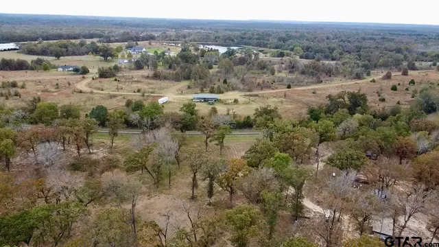 a view of a town with mountains in the background