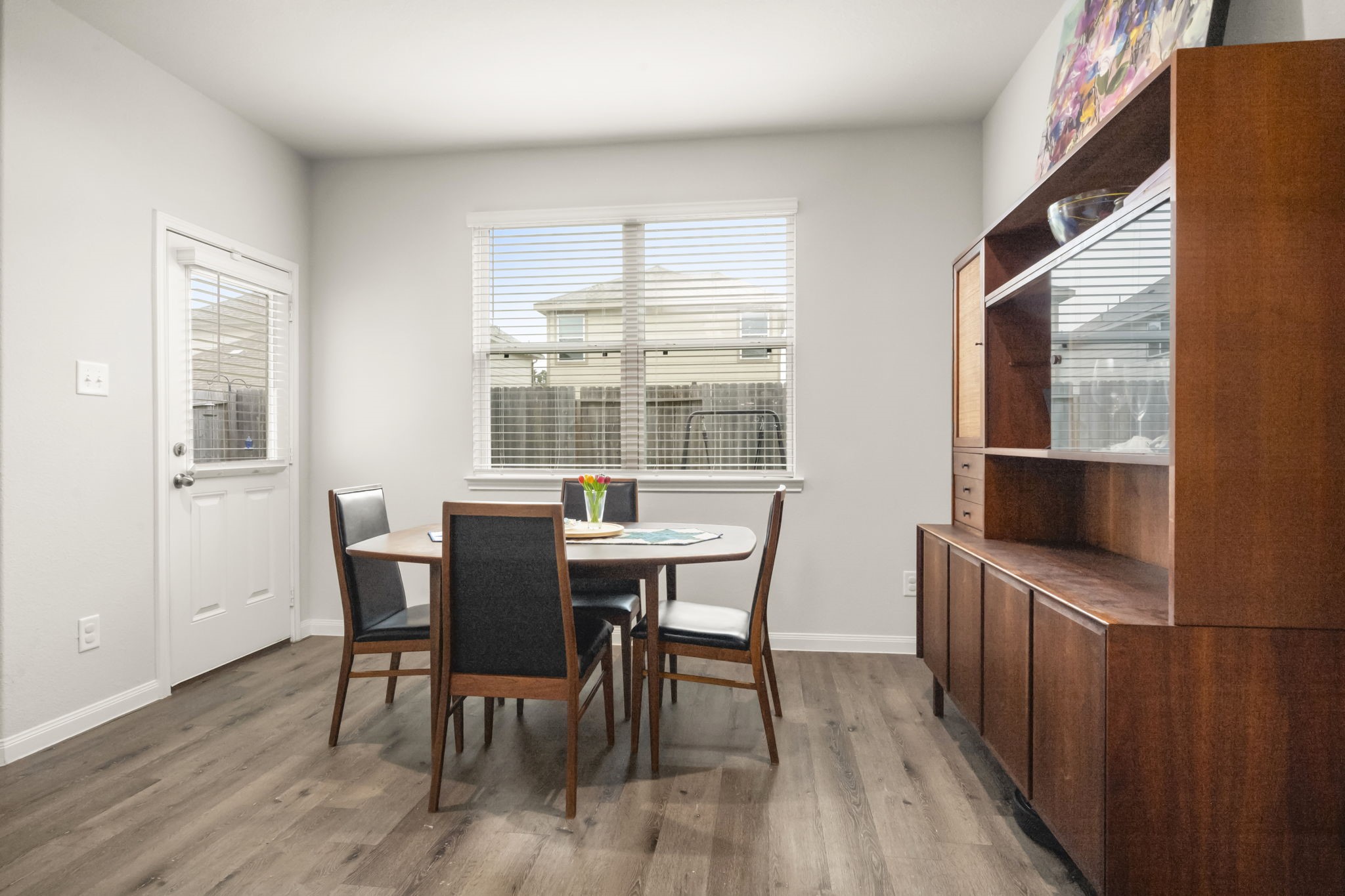 4915 Blue Jacaranda Way Spring, TX 77373 - Photo 12 of 30 Breakfast room overlooks the backyard and the long wall offers a place for your favorite wall art or hutch.
