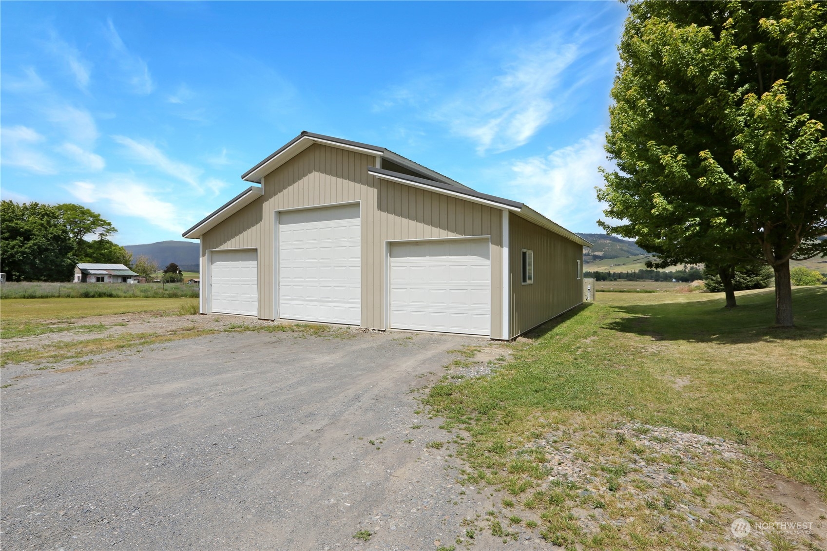 708 V Hoffman Road Kettle Falls, WA 99141 - Photo 9 of 40 a view of a house with a yard