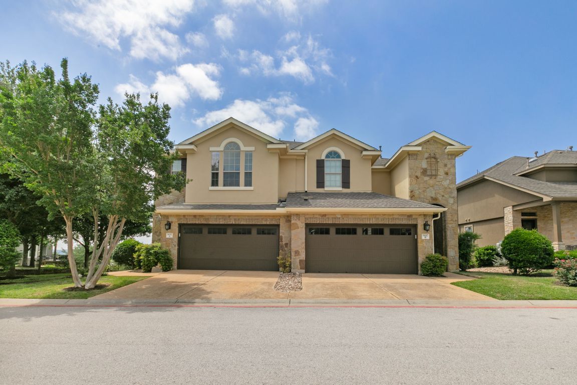 9617 Solana Vista Loop, Unit A Austin, TX 78750 - Photo 13 of 35 a front view of a house with a yard and garage