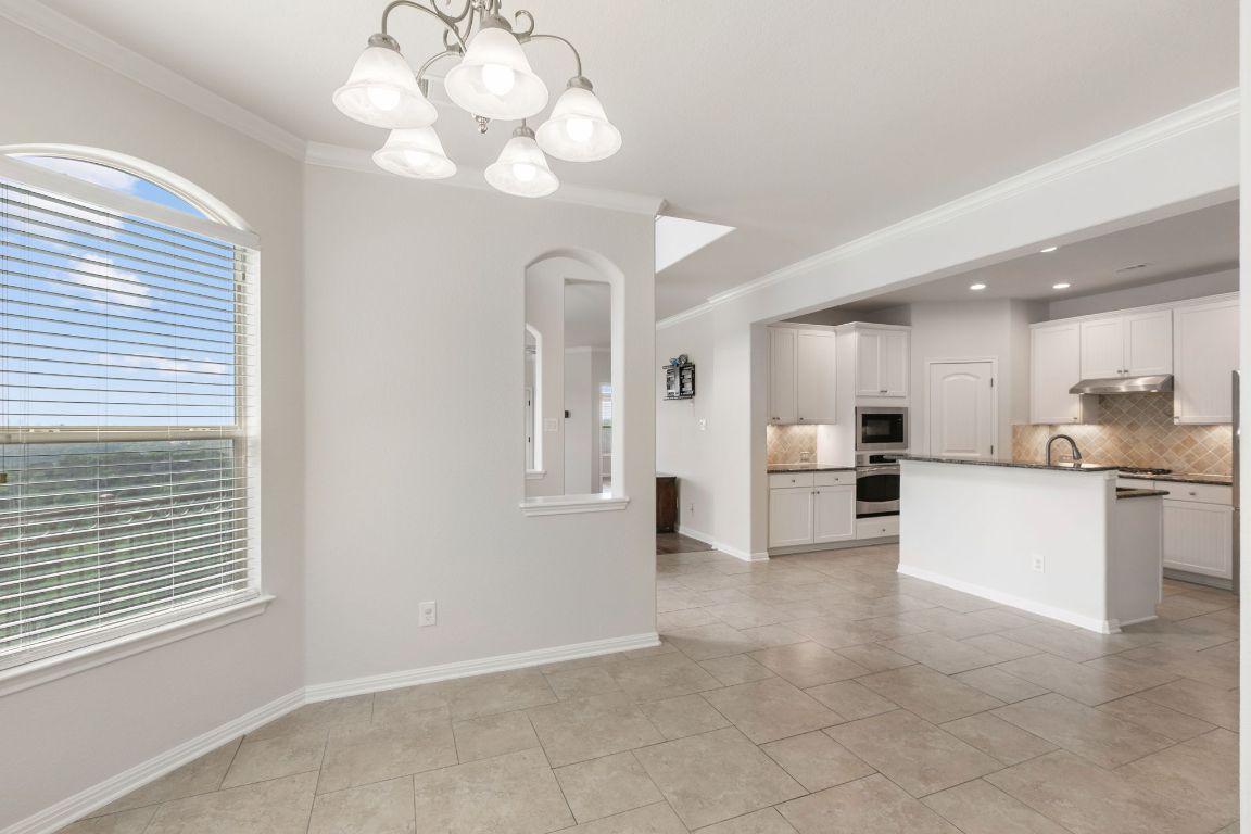 9617 Solana Vista Loop, Unit A Austin, TX 78750 - Photo 21 of 35 a view of a kitchen with a sink and a stove top oven