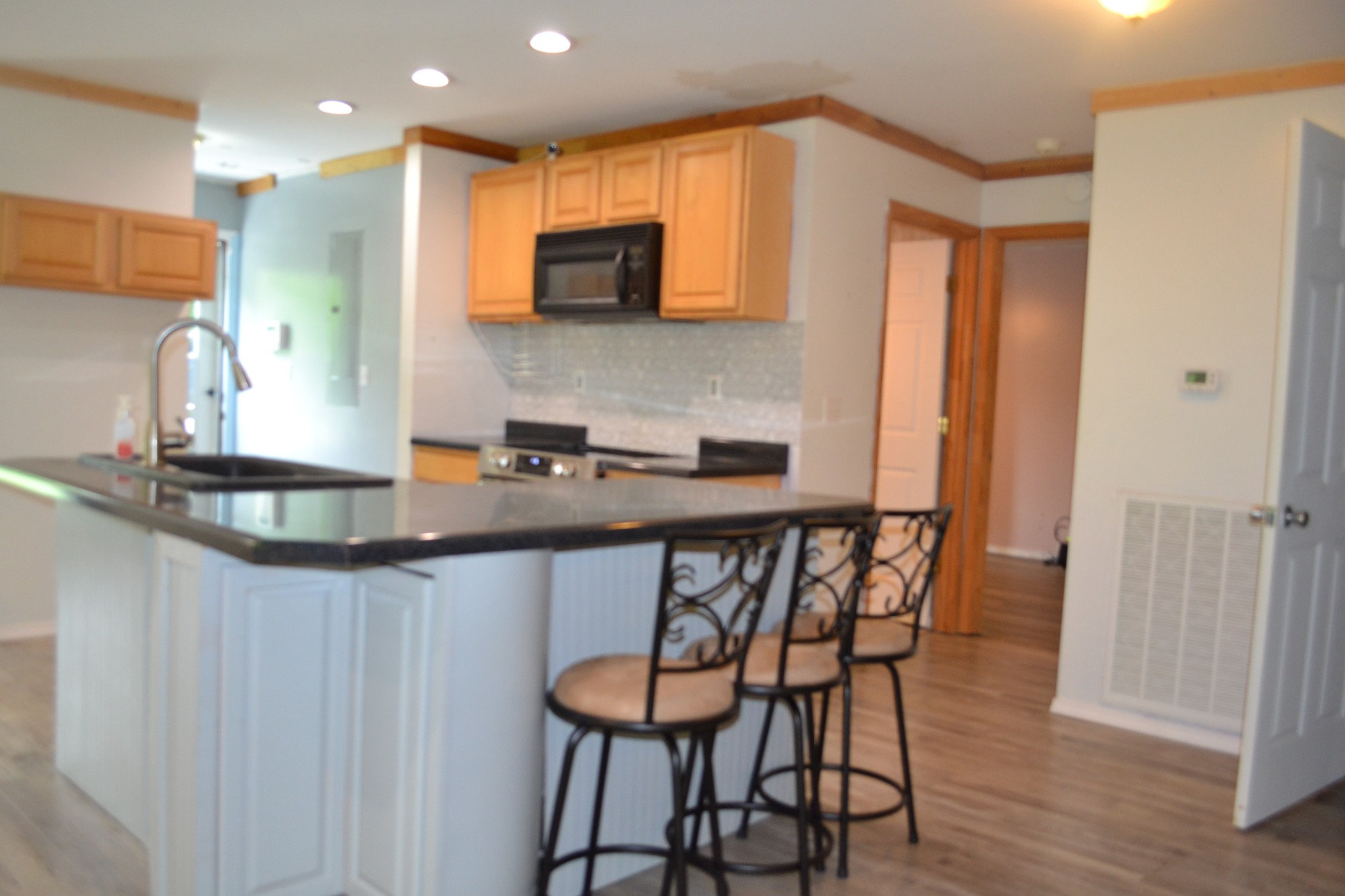 1505 Add Stafford Road Hilham, TN 38568 - Photo 7 of 65 a kitchen with stainless steel appliances granite countertop a sink table and chairs