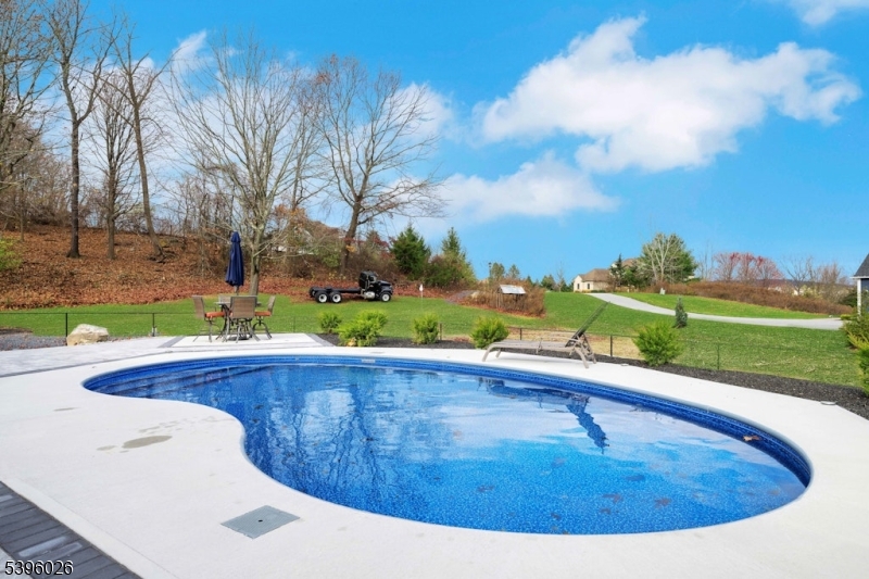 4435 Rudetown Road Hamburg, NJ 07419 - Photo 7 of 24 a view of a swimming pool with a yard and potted plants