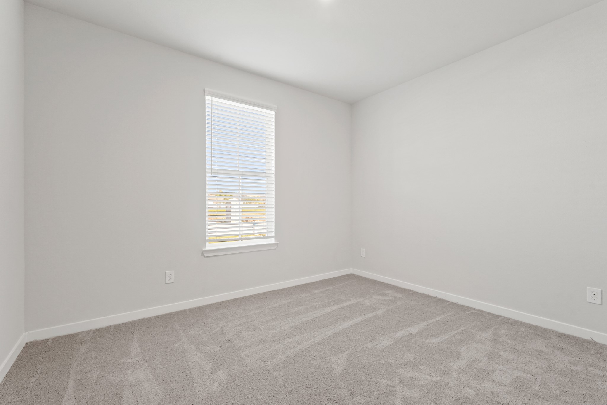 112 Water Grass Trail Clute, TX 77531 - Photo 13 of 36 an empty room with a window