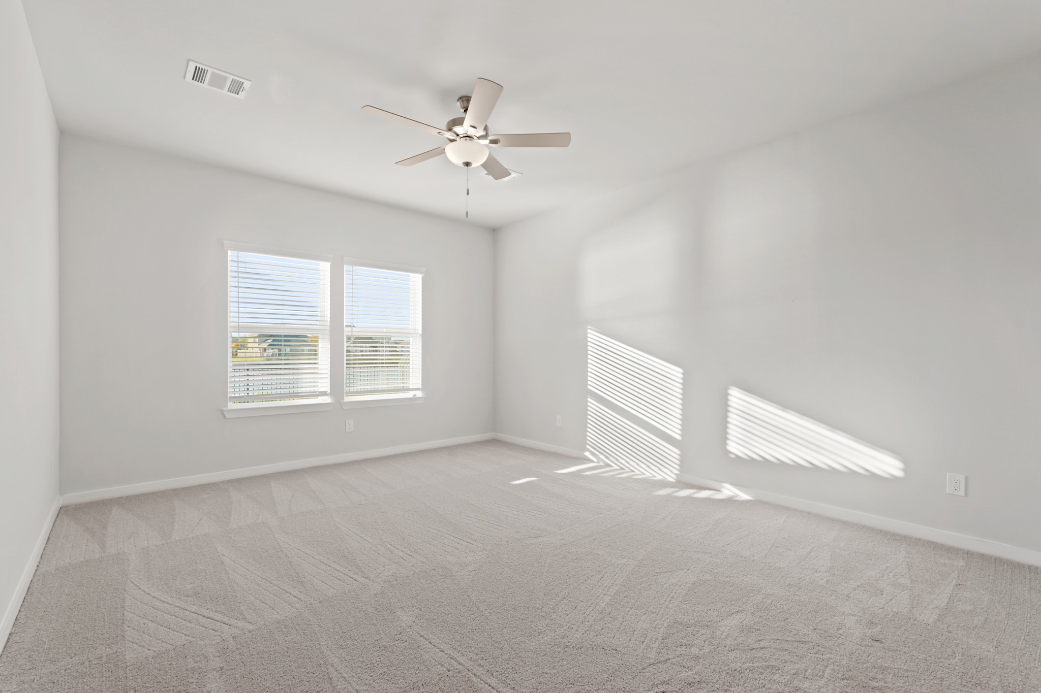 112 Water Grass Trail Clute, TX 77531 - Photo 17 of 36 a view of an empty room with a window