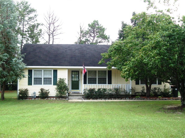 5960 Mt Pleasant Church Road, Unit 102 Macon, GA 31216 - Photo 1 of 1 a front view of house with yard and green space