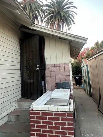 a table and chairs in front of a house