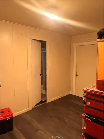 a room with a sink furniture and a potted plant