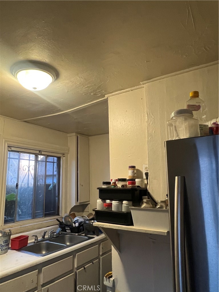 586 West Center Street Pomona, CA 91768 - Photo 15 of 17 a room with a sink furniture and a potted plant