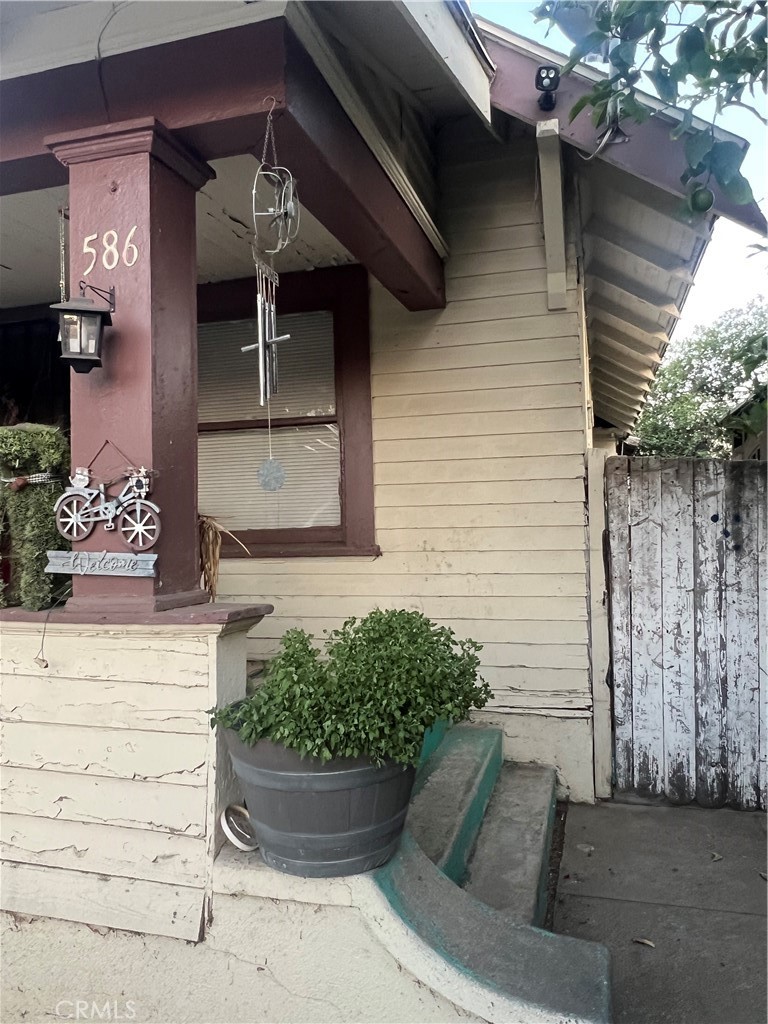 586 West Center Street Pomona, CA 91768 - Photo 2 of 17 a front view of a house with entryway