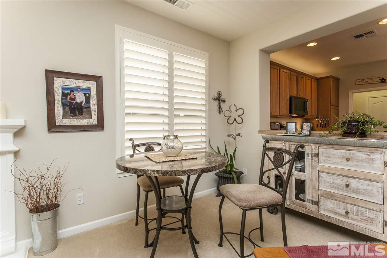470 Sysonby Court Reno, NV 89521 - Photo 13 of 36 a view of a dining room with furniture and a potted plant