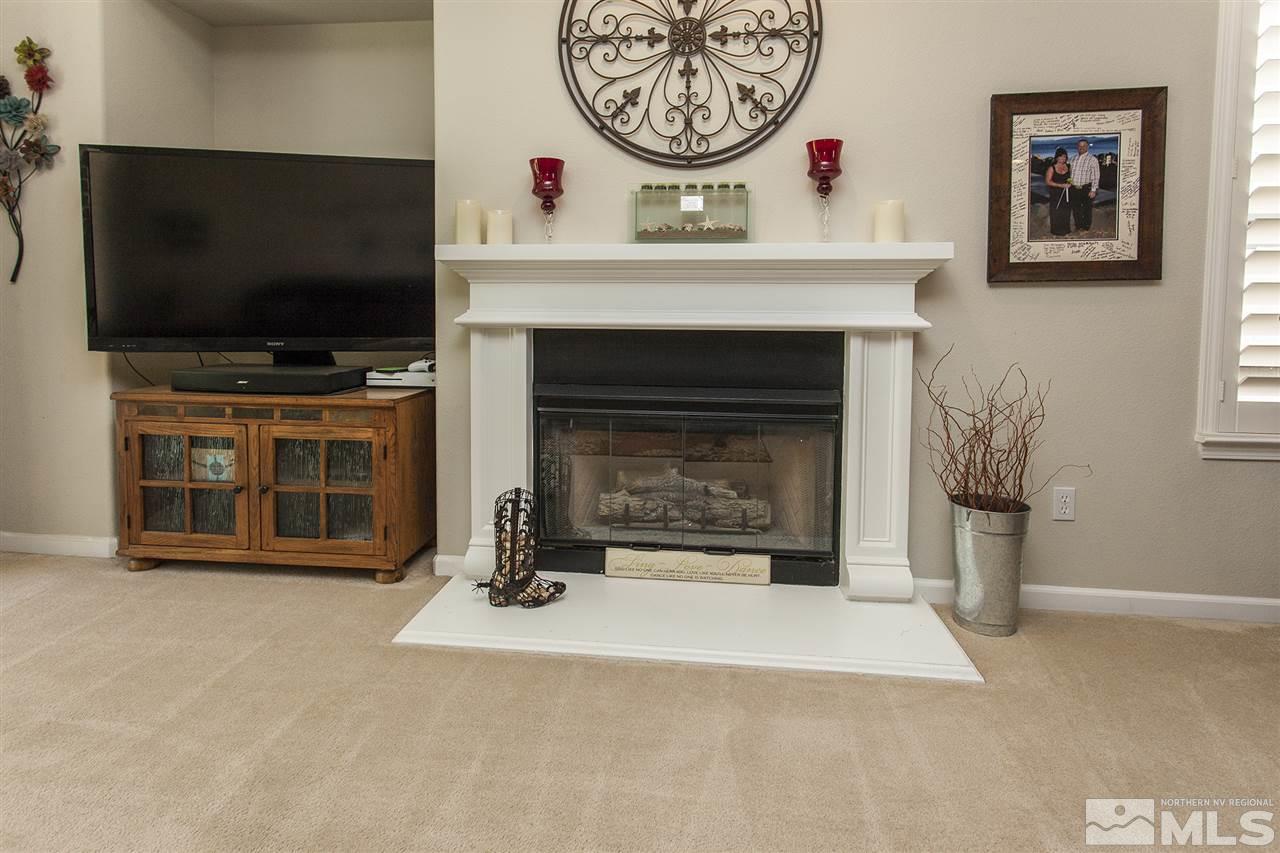 470 Sysonby Court Reno, NV 89521 - Photo 16 of 36 a view of a livingroom with a fireplace and a flat screen tv