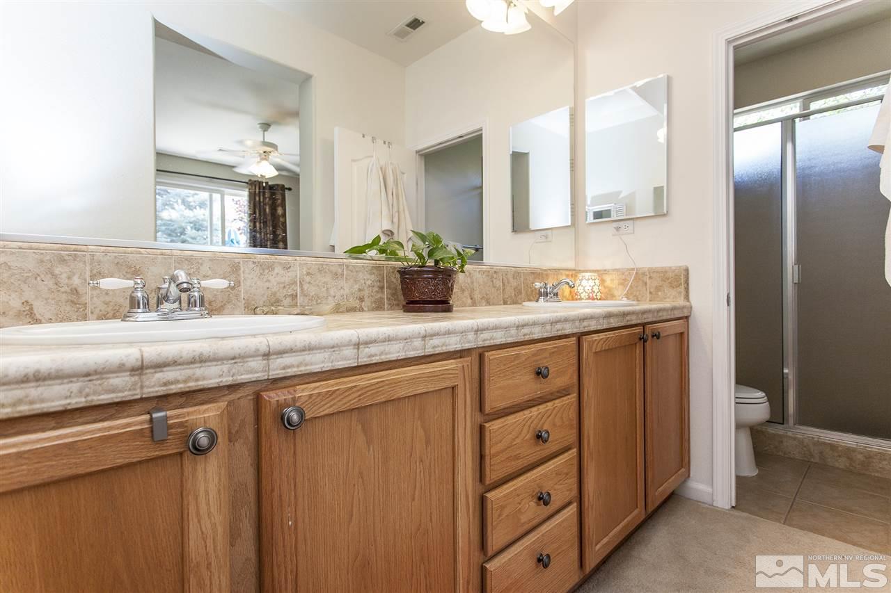 470 Sysonby Court Reno, NV 89521 - Photo 20 of 36 a bathroom with a sink double vanity and a mirror