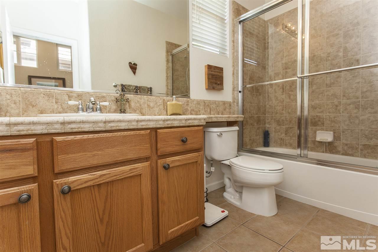 470 Sysonby Court Reno, NV 89521 - Photo 25 of 36 a bathroom with a toilet a sink and shower