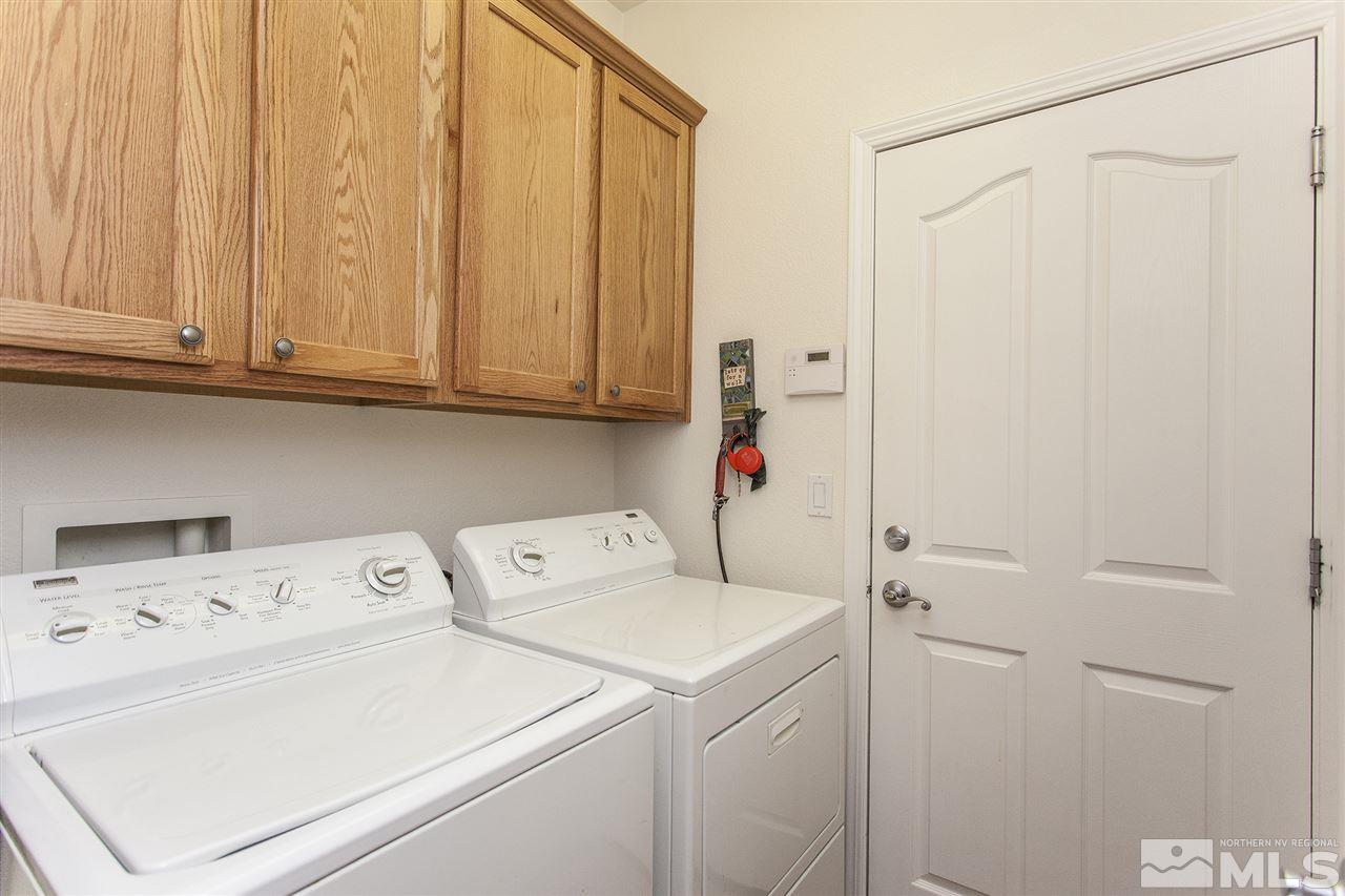 470 Sysonby Court Reno, NV 89521 - Photo 29 of 36 a view of storage and utility room with washer and dryer