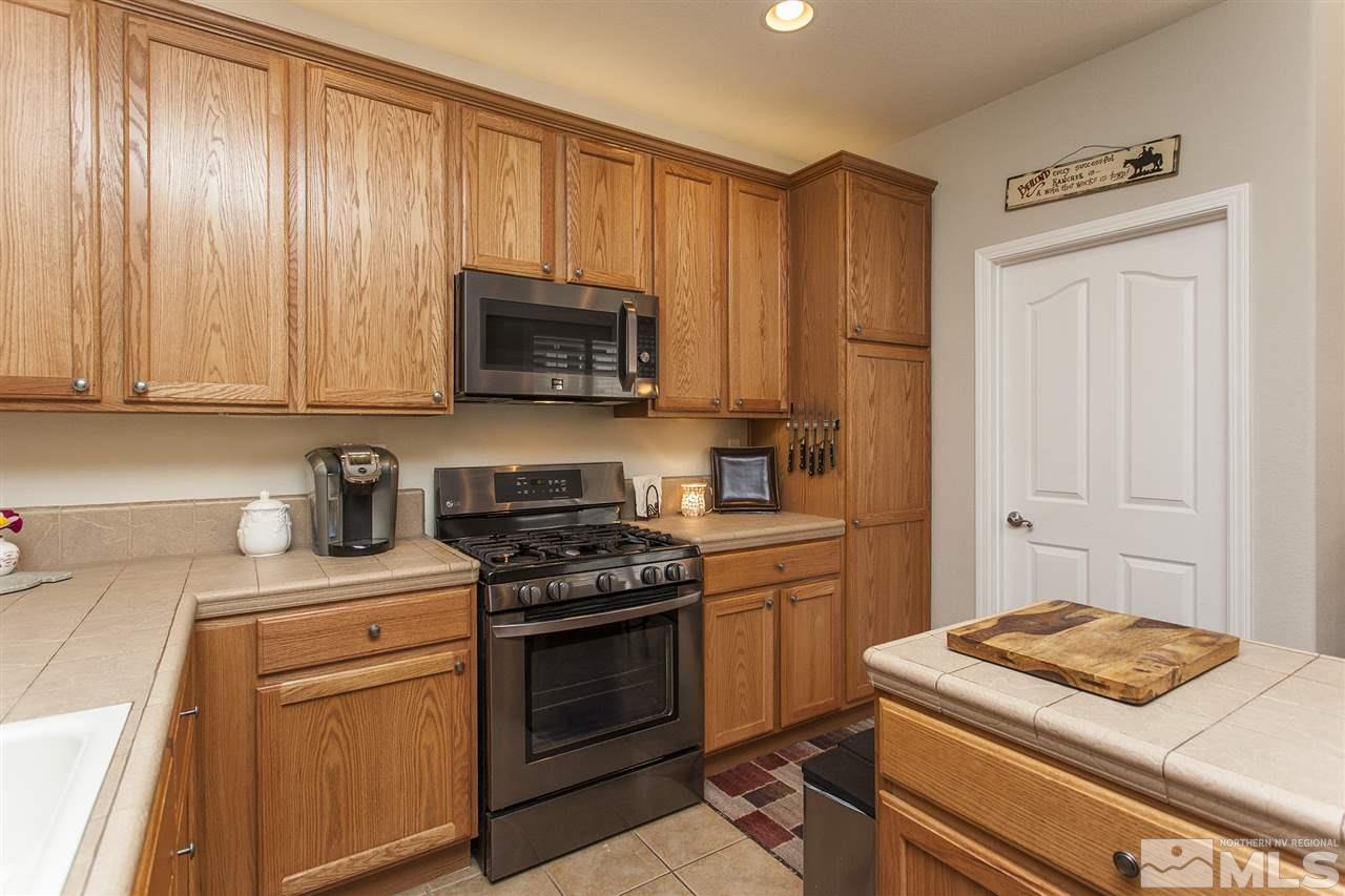 470 Sysonby Court Reno, NV 89521 - Photo 6 of 36 a kitchen with a stove and a sink