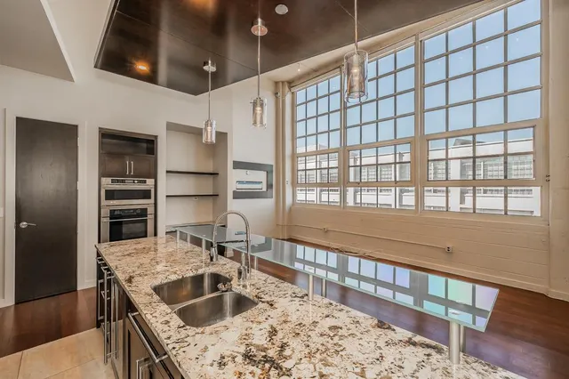 a kitchen with a stove and a sink