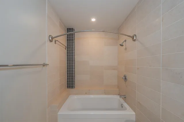 a bathroom with a bath tub