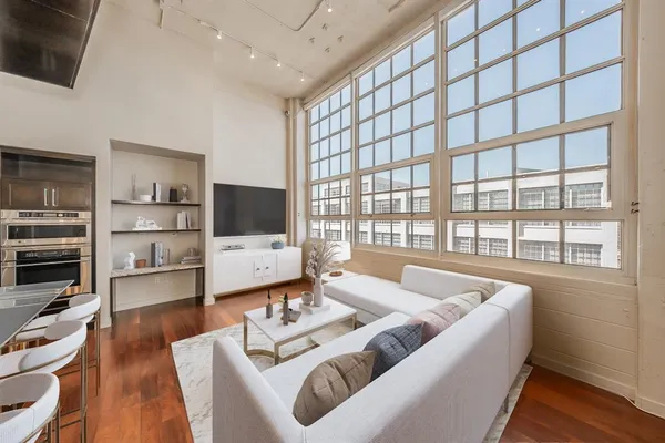a living room with furniture and a flat screen tv