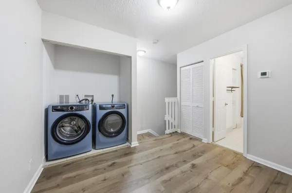 a view of space with washer and dryer