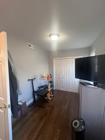 a room with furniture and wooden floor