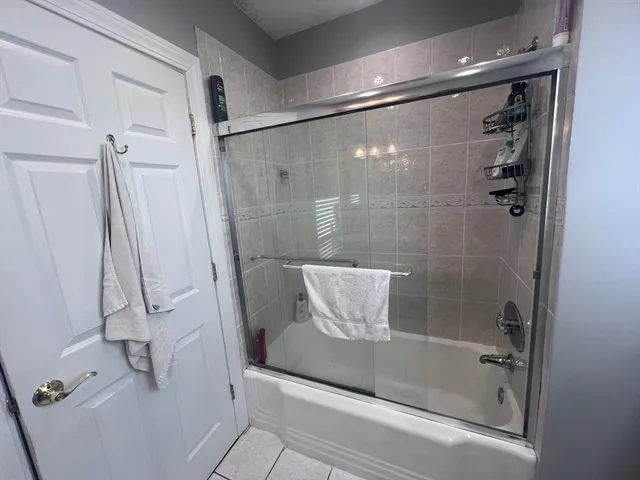 a view of hallway with wooden floor