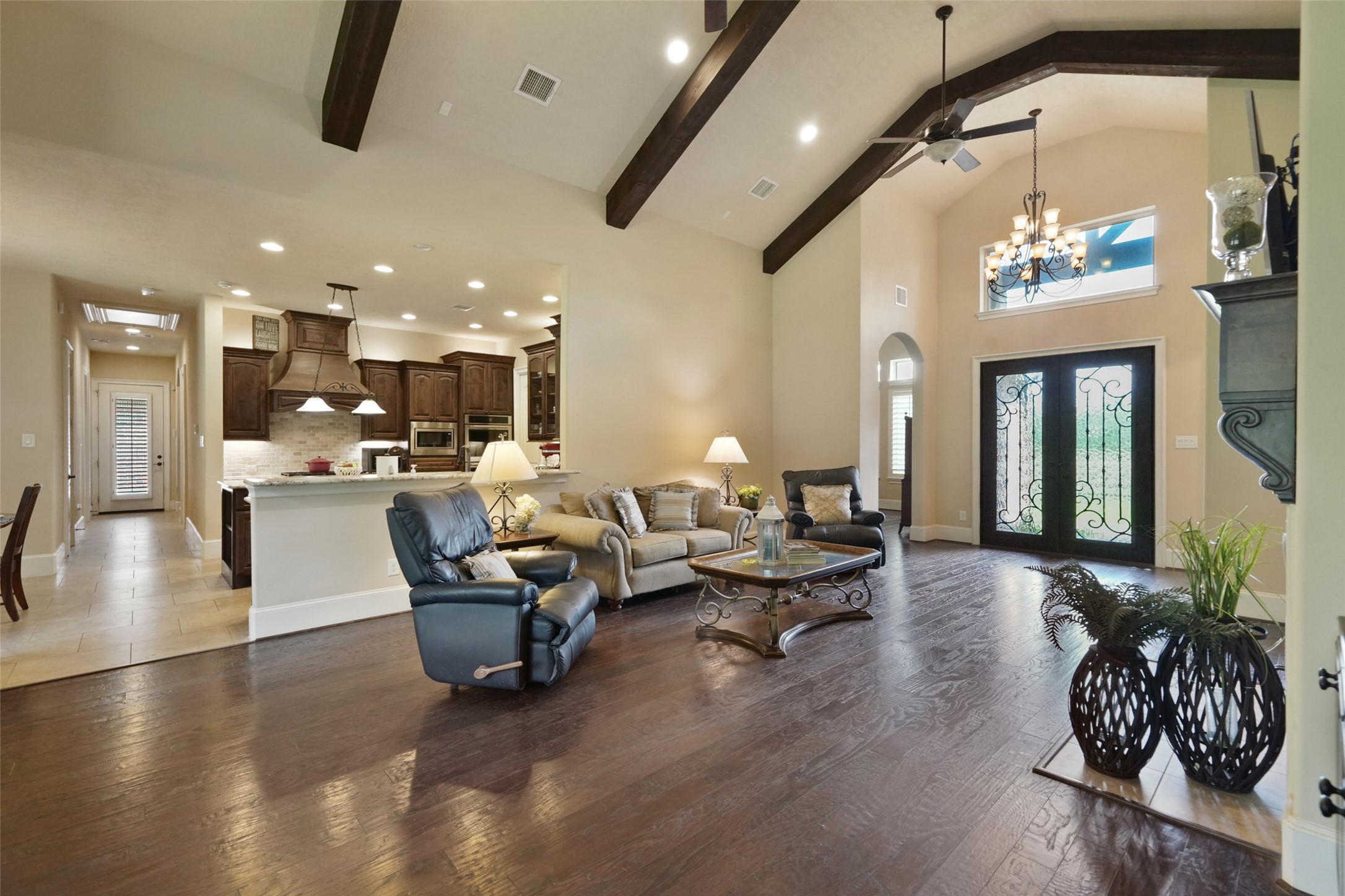 26250 A Riley Road Waller, TX 77484 - Photo 6 of 50 A thoughtful open layout unites the living, kitchen, and foyer, enhanced with designer lighting, warm tones, and plenty of natural light.