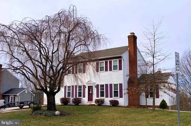 a front view of a building with garden