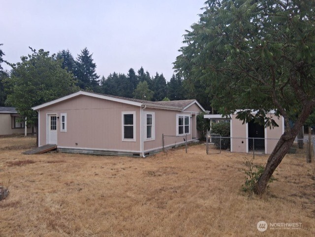 915 Union Mills Road Southeast, Unit 11 Lacey, WA 98503 - Photo 14 of 15 a view of a house with backyard