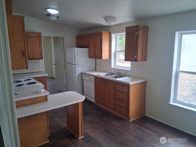 915 Union Mills Road Southeast, Unit 11 Lacey, WA 98503 - Photo 5 of 15 a kitchen with a sink cabinets and window