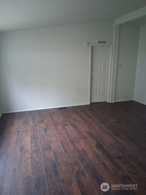 915 Union Mills Road Southeast, Unit 11 Lacey, WA 98503 - Photo 7 of 15 a view of an empty room with wooden floor