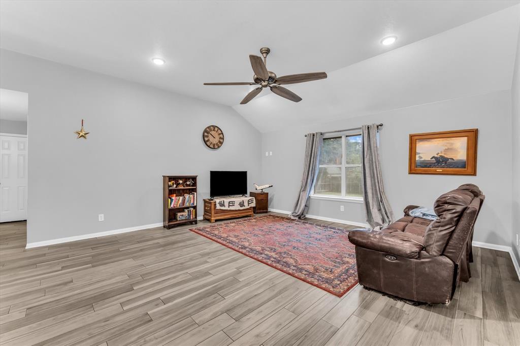 7 Market Loop Morgan's Point Resort, TX 76513 - Photo 12 of 31 Spacious room featuring a ceiling fan, two windows.