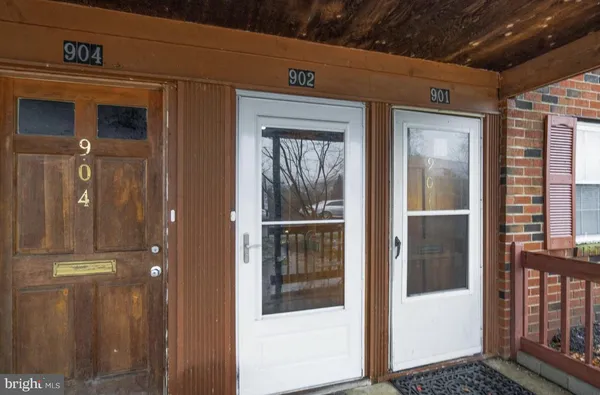 a view of a door and a window