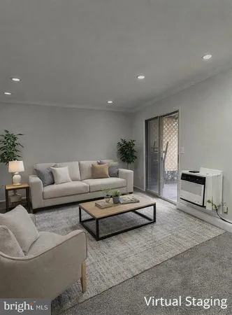 a living room with furniture and a rug