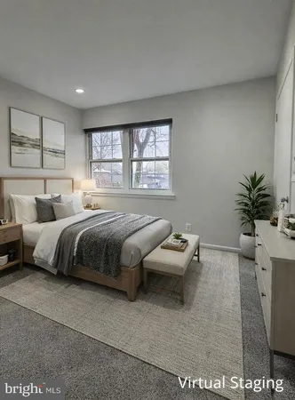 a bedroom with bed and window