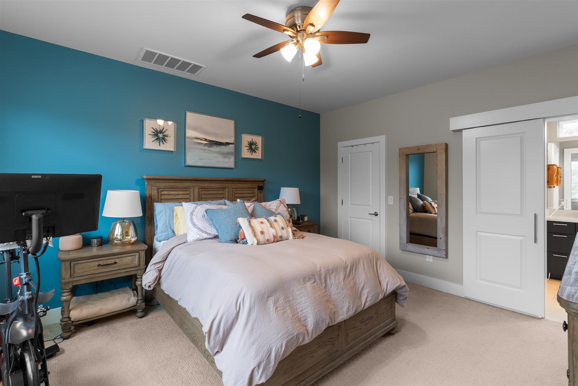 3806 Bull Creek Road, Unit B Austin, TX 78731 - Photo 20 of 32 The spacious upstairs primary suite offers a light-filled bedroom, a luxurious ensuite spa bathroom, and an exceptional custom California Closets® walk-in closet that provides beautifully designed, highly functional storage.