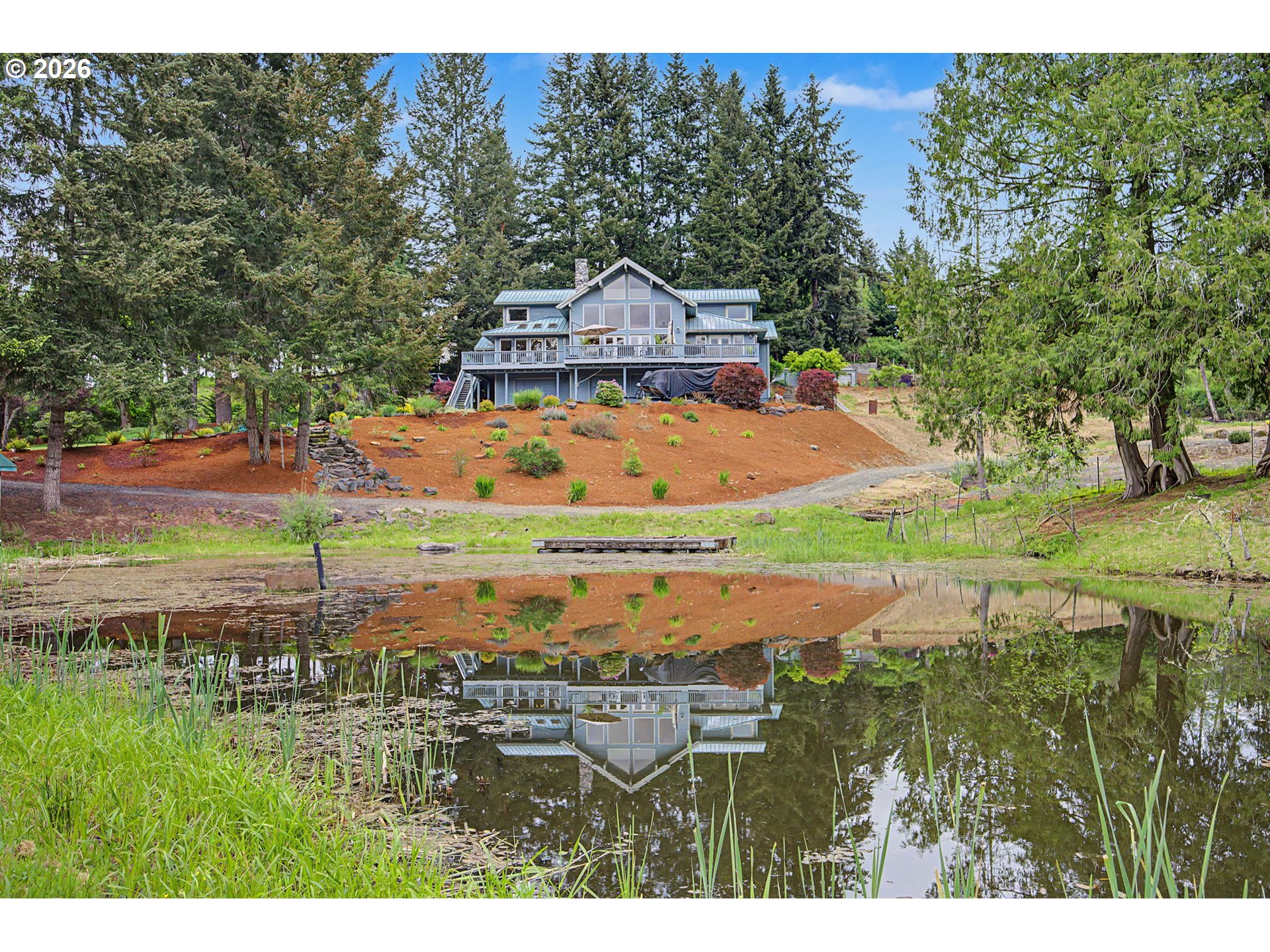23303 Southeast Howlett Road Eagle Creek, OR 97022 - Photo 1 of 48 a aerial view of a house with a yard
