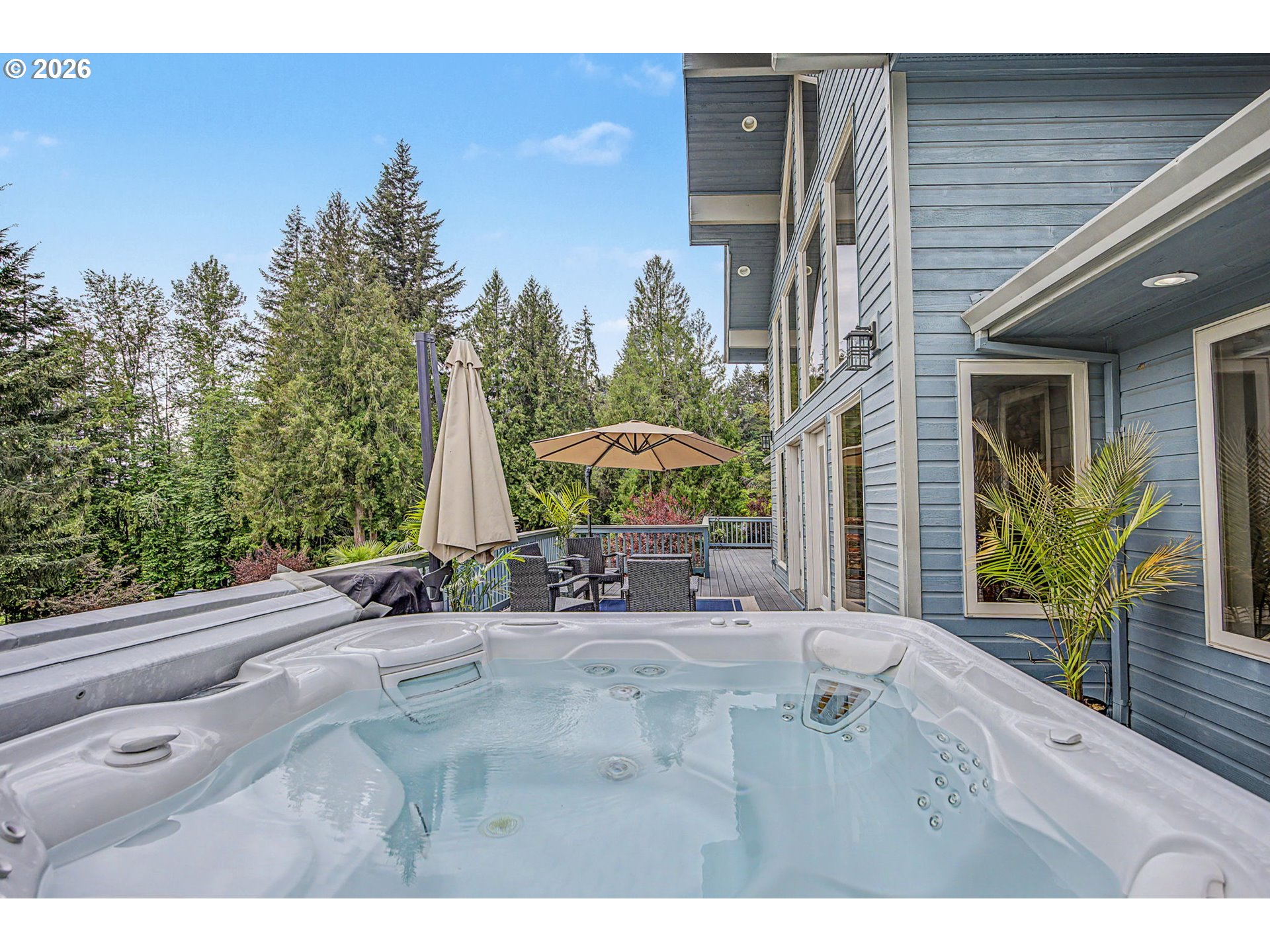 23303 Southeast Howlett Road Eagle Creek, OR 97022 - Photo 38 of 48 a view of a patio with table and chairs and potted plants