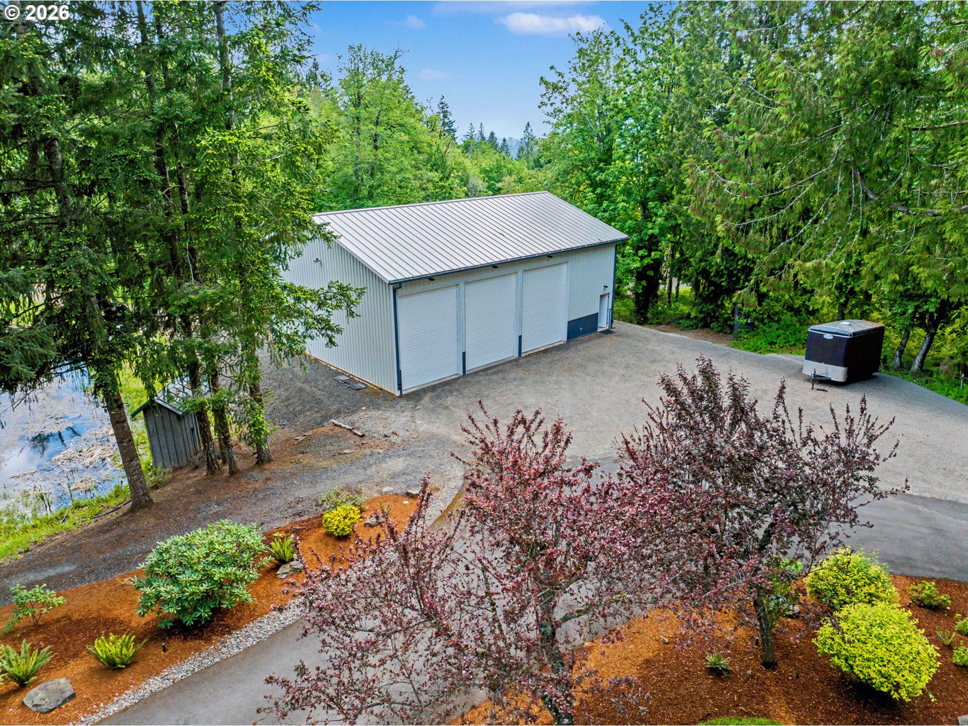 23303 Southeast Howlett Road Eagle Creek, OR 97022 - Photo 42 of 48 a view of a backyard with a garden
