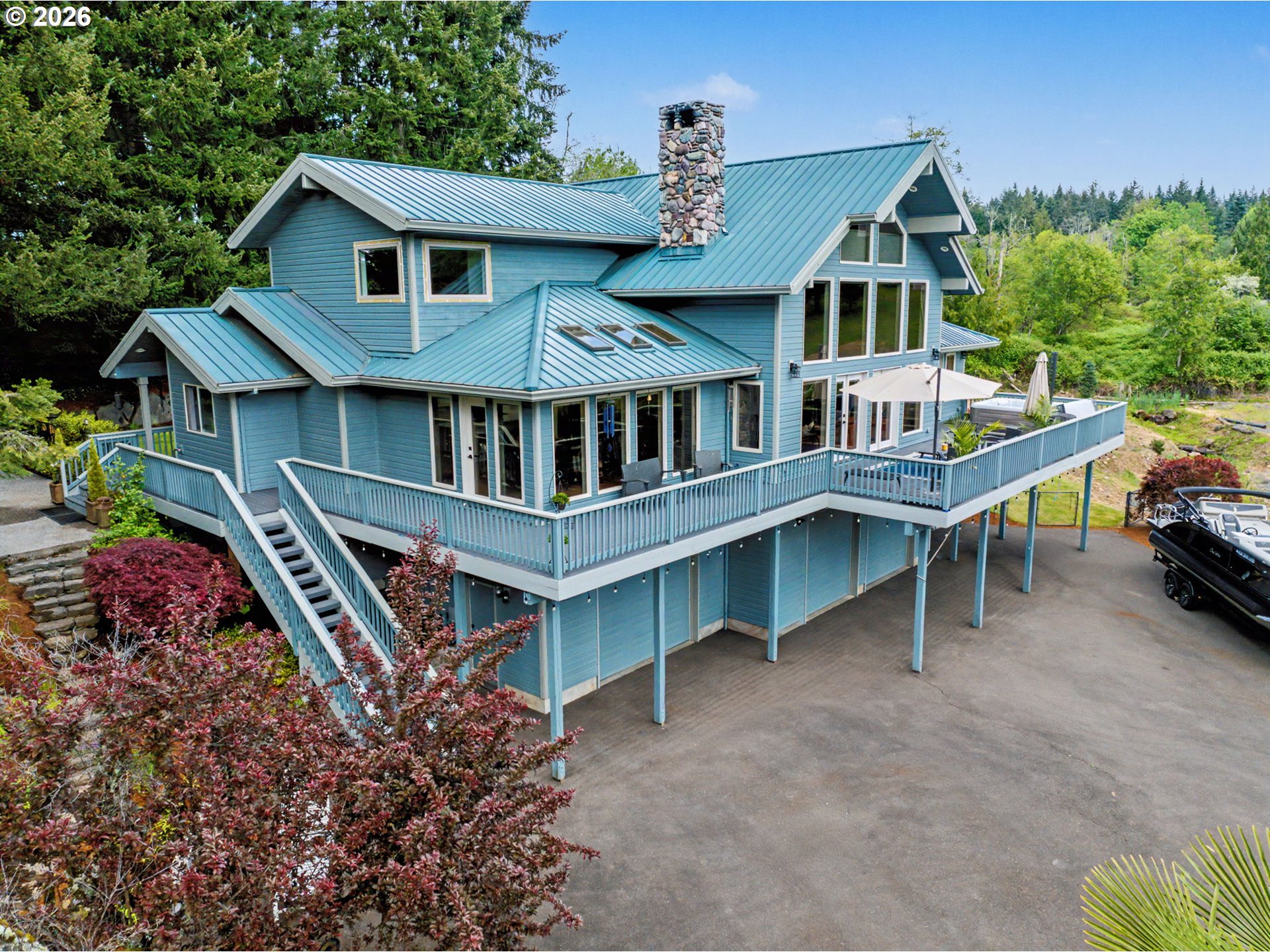 23303 Southeast Howlett Road Eagle Creek, OR 97022 - Photo 47 of 48 a view of a house with roof deck and couches