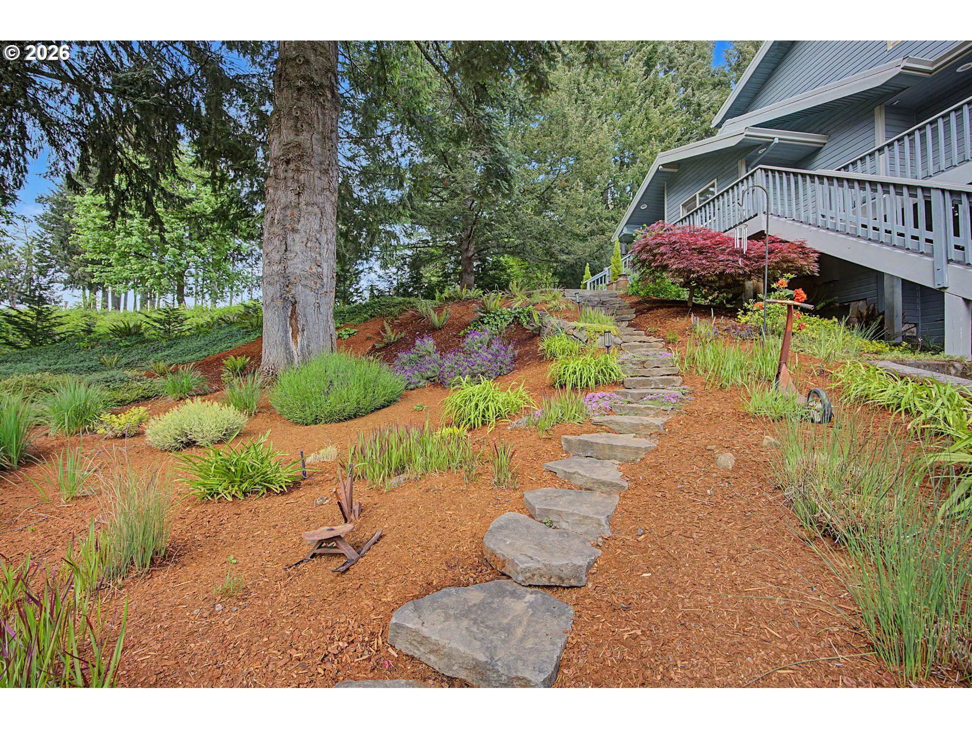 23303 Southeast Howlett Road Eagle Creek, OR 97022 - Photo 9 of 48 a backyard of a house with garden and lake view