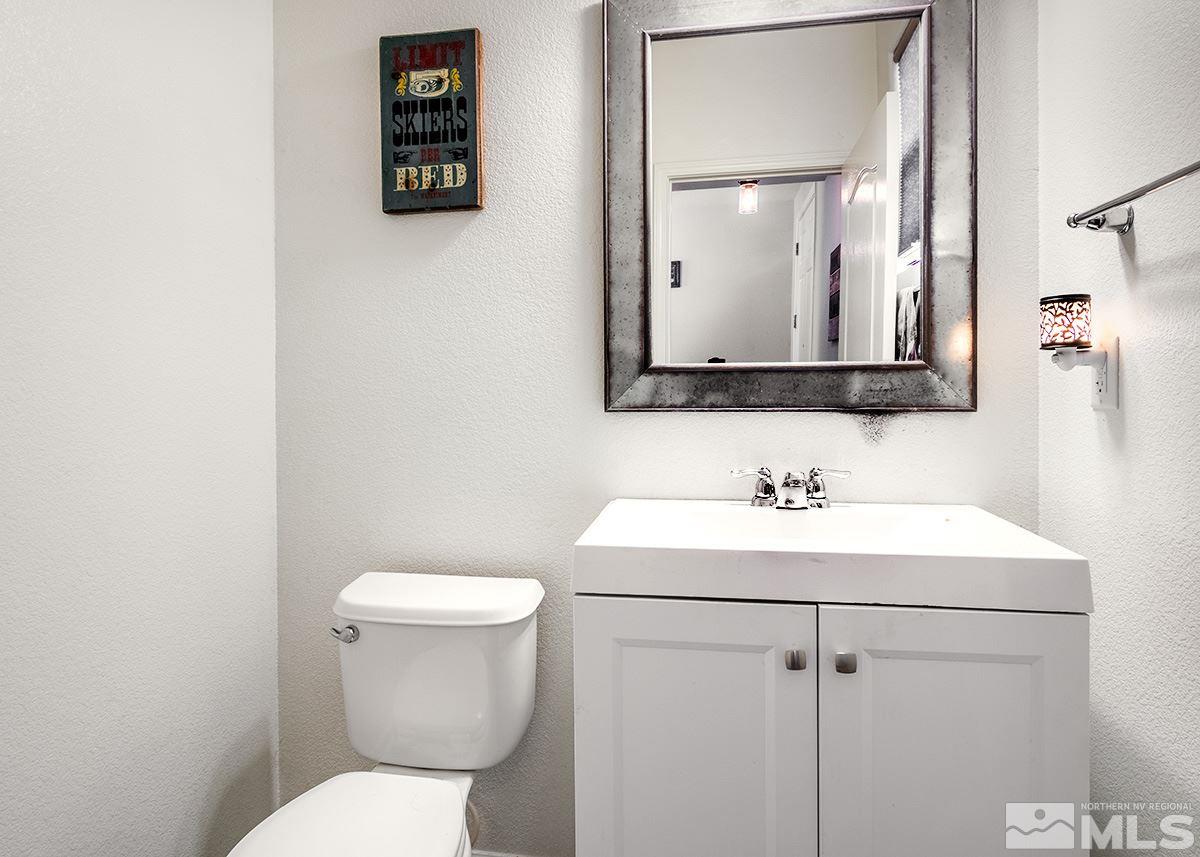 590 Verelli Court Reno, NV 89521 - Photo 11 of 23 a bathroom with a toilet sink and mirror