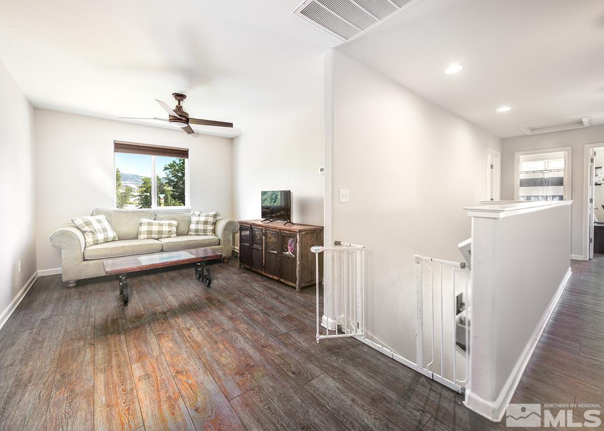 590 Verelli Court Reno, NV 89521 - Photo 12 of 23 a living room with furniture and a wooden floor