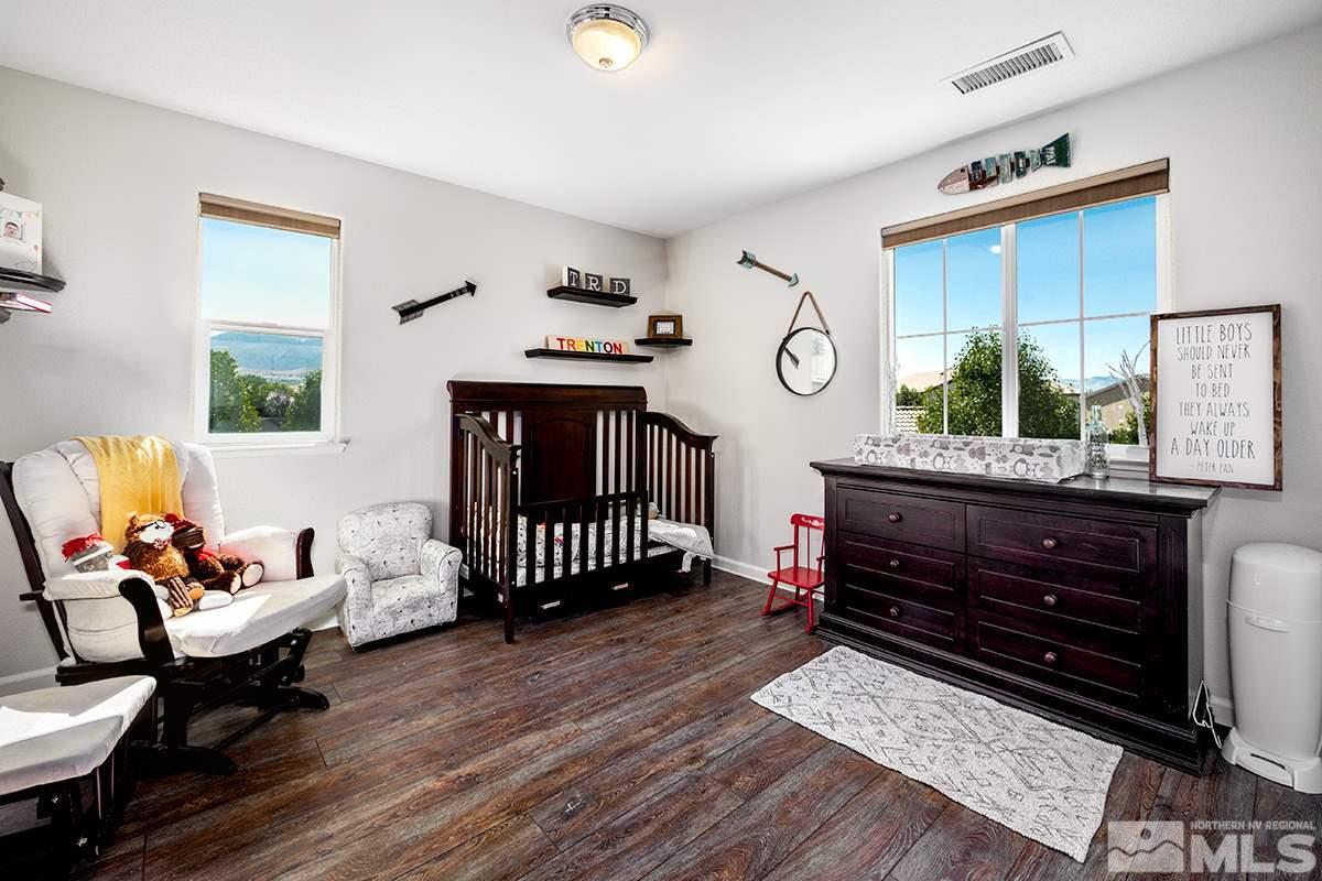 590 Verelli Court Reno, NV 89521 - Photo 15 of 23 a bedroom with furniture and wooden floor