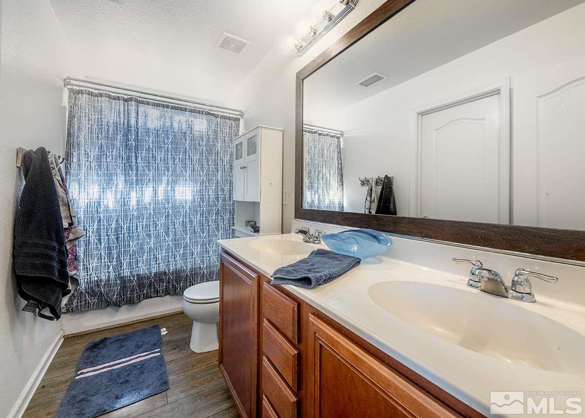 590 Verelli Court Reno, NV 89521 - Photo 19 of 23 a bathroom with a sink toilet and shower